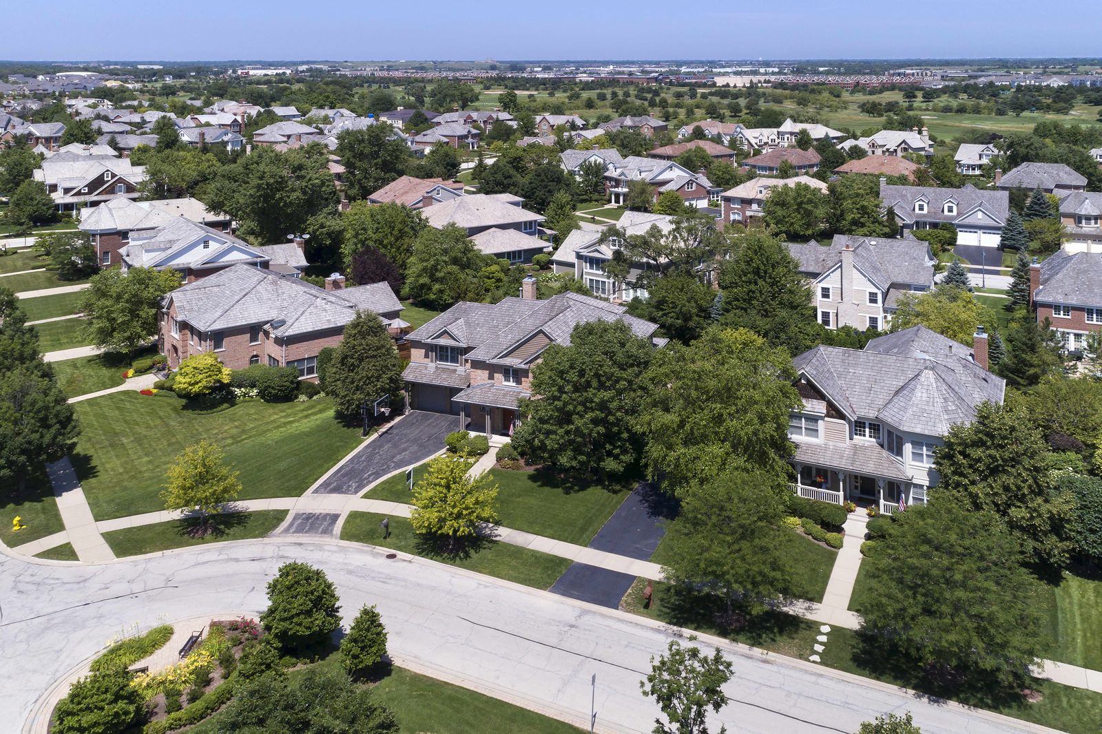 Aerial view of a suburban Illinois street of two-story houses